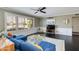 Living room with blue sofa, hanging chair, and dark hardwood floors at 2011 E La Jolla Dr, Tempe, AZ 85282