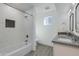 Bathroom with double vanity and marble tile at 2039 E Aspen Dr, Tempe, AZ 85282