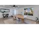 Light-filled dining area with wood table and access to the front yard at 2039 E Aspen Dr, Tempe, AZ 85282