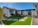 Landscaped front yard with artificial turf and brick walkways at 2039 E Aspen Dr, Tempe, AZ 85282