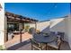 Covered patio with dining area and built-in grill at 2039 E Aspen Dr, Tempe, AZ 85282