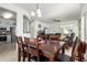 Dining room with dark wood table and chairs, open to kitchen at 22516 N Via De La Caballa --, Sun City West, AZ 85375