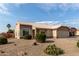 Tan colored house with a two-car garage and desert landscaping at 22516 N Via De La Caballa --, Sun City West, AZ 85375