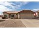 One-story house with tan exterior, two-car garage, and landscaped yard at 22516 N Via De La Caballa --, Sun City West, AZ 85375