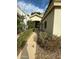 Home's entrance with a walkway and lush landscaping at 2322 S Rogers -- # 9, Mesa, AZ 85202