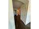 Clean hallway with wood-look laminate flooring leading to bedrooms and bathroom at 2322 S Rogers -- # 9, Mesa, AZ 85202