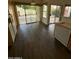 Kitchen with dark hardwood floors and backyard access at 2322 S Rogers -- # 9, Mesa, AZ 85202