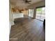 Open living area with laminate flooring and access to backyard at 2322 S Rogers -- # 9, Mesa, AZ 85202