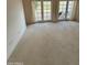 Spacious living room with patio doors and carpet at 2322 S Rogers -- # 9, Mesa, AZ 85202