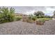 Landscaped backyard with raised garden beds and a gravel pathway at 24435 S 195Th St, Queen Creek, AZ 85142