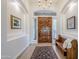 Bright entryway with hardwood floors and wood bench at 24435 S 195Th St, Queen Creek, AZ 85142