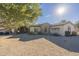 House exterior showcasing stone accents and landscaping at 24435 S 195Th St, Queen Creek, AZ 85142