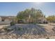 House exterior with American flag and landscaping at 24435 S 195Th St, Queen Creek, AZ 85142