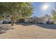 Single-story home with stone accents and a landscaped yard at 24435 S 195Th St, Queen Creek, AZ 85142