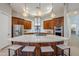 Modern kitchen with large granite island and stainless steel appliances at 24435 S 195Th St, Queen Creek, AZ 85142