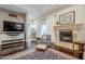 Cozy living room with hardwood floors and a fireplace at 24435 S 195Th St, Queen Creek, AZ 85142