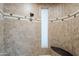 Tiled shower with built-in seat and window at 24435 S 195Th St, Queen Creek, AZ 85142