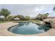 Relaxing pool with a rock waterslide feature at 24435 S 195Th St, Queen Creek, AZ 85142