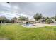 Inviting kidney-shaped pool with rock waterfall feature at 24435 S 195Th St, Queen Creek, AZ 85142