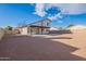 Spacious backyard with gravel and block wall at 2513 N 90Th Ln, Phoenix, AZ 85037