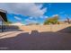 Large backyard with gravel and block wall at 2513 N 90Th Ln, Phoenix, AZ 85037