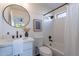 Modern bathroom with white vanity and bathtub at 2513 N 90Th Ln, Phoenix, AZ 85037