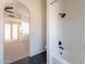 Bathroom with white subway tile, bathtub, and hexagon floor tile at 2513 N 90Th Ln, Phoenix, AZ 85037