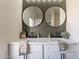 Modern bathroom with double vanity and large mirrors at 2513 N 90Th Ln, Phoenix, AZ 85037