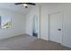 Bedroom with vaulted ceiling, window, and bathroom access at 2513 N 90Th Ln, Phoenix, AZ 85037