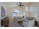 Bright living room with vaulted ceiling and hardwood floors at 2513 N 90Th Ln, Phoenix, AZ 85037