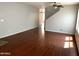 Living room with hardwood floors and neutral walls at 25527 W Burgess Ln, Buckeye, AZ 85326