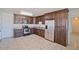 Modern kitchen with stainless steel appliances and dark wood cabinets at 2738 N 40Th Dr, Phoenix, AZ 85009