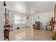 Living room with tiled floor, comfy chair, and decorative accents at 2738 N 40Th Dr, Phoenix, AZ 85009