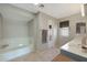 Bathroom with a soaking tub, double vanity, and tiled floor at 277 E Windsor Ct, Gilbert, AZ 85296