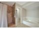 Bathroom with shower stall, bathtub, and tile flooring at 277 E Windsor Ct, Gilbert, AZ 85296