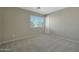 Spacious bedroom with carpeted floor and window at 277 E Windsor Ct, Gilbert, AZ 85296