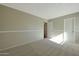 Well-lit bedroom with carpeted floor and two doors at 277 E Windsor Ct, Gilbert, AZ 85296