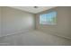 Bedroom featuring neutral walls, carpet, and a window at 277 E Windsor Ct, Gilbert, AZ 85296