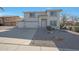 Two-story house with a two-car garage and desert landscaping at 277 E Windsor Ct, Gilbert, AZ 85296