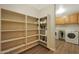 Well-organized pantry offers ample shelving for food storage at 277 E Windsor Ct, Gilbert, AZ 85296