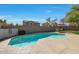 Inviting kidney-shaped pool surrounded by a patio at 277 E Windsor Ct, Gilbert, AZ 85296