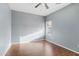 Light-filled bedroom featuring wood floors and window blinds at 2950 W Louise Dr # 203, Phoenix, AZ 85027