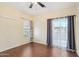 Bedroom with wood floors, window, and patio access at 2950 W Louise Dr # 203, Phoenix, AZ 85027