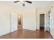 Bedroom with wood floors and access to kitchen and closet at 2950 W Louise Dr # 203, Phoenix, AZ 85027