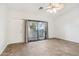 Bright bedroom with wood floors and access to a private balcony at 2950 W Louise Dr # 203, Phoenix, AZ 85027