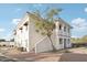 Two-story building with Spanish-style architecture and a landscaped courtyard at 2950 W Louise Dr # 203, Phoenix, AZ 85027