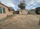 Backyard view showcasing shed and partial home view at 3143 W Garfield St, Phoenix, AZ 85009