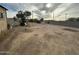 Large, flat backyard with a view of a neighboring home at 3143 W Garfield St, Phoenix, AZ 85009