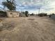 Large, flat backyard with shed and sparse vegetation at 3143 W Garfield St, Phoenix, AZ 85009