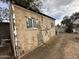 Rustic wooden shed with double doors and windows in the backyard at 3143 W Garfield St, Phoenix, AZ 85009